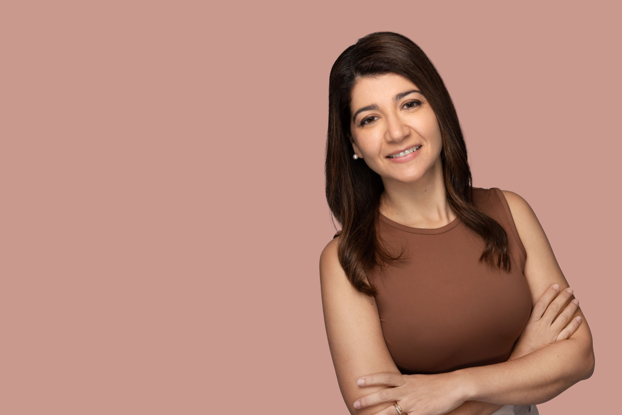 Woman staring back at us with smooth skin