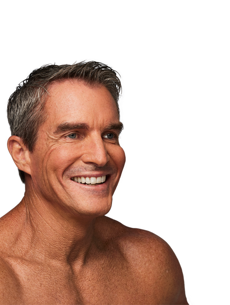 Man smiling with smooth facial features